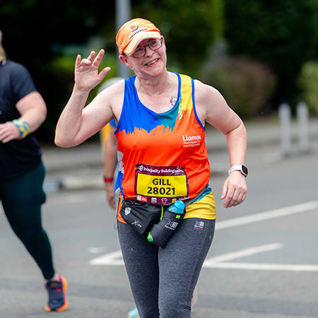 Gill running the Cardiff Half Marathon in 2023 for Llamau